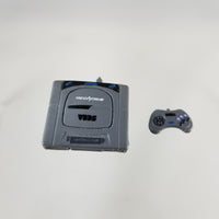 532 -Sega Saturn's Game console and controller with hands
